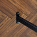 A minimalist retro rectangular dining table with a specially textured top and black metal legs.Contemporary Minimalist MDF Dark Wood Textured Tabletop.Able To Give People A Visual Beauty With Rules. - DTYStore